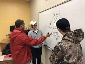 Dancer (to the left) leads a tutoring session on campus. <i>Photo courtesy Dancer.</i>