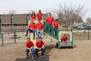 Members of the Cyclone Energy team outside Iowa State University's Family Resource Center. <i>Pictured (left to right &amp; bottom to top)</i>: Collin Blatchford, Devin Gaudette, Leo Brocka, Jordan Girolamo, JP Penton, Grace Mergens, Conor O’Brien, Beth Hartmann (advisor) and Jonathan Hoehne. <i> Photo Courtesy Cyclone Energy.</i>