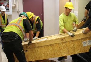 Crew members moving crate