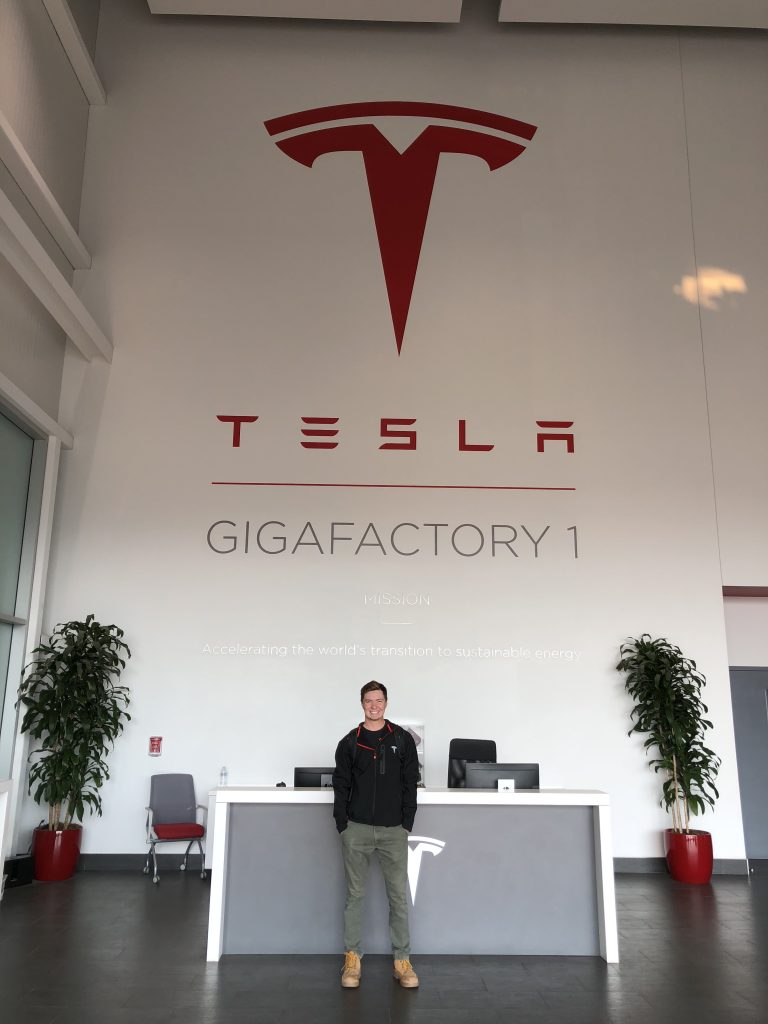 IE student Thomas Berquist poses in Tesla's Nevada office.