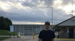 Alex Lewis stands in front of the International Paper location in Cedar Rapids, Iowa.