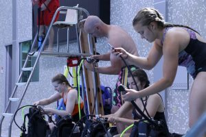 Participants get their first taste of astronaut training learning scuba basics at State Gym. 