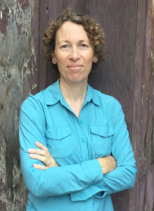 Nicola Bowler stands by wall.