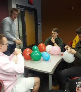 Students collaborating on balloon activity