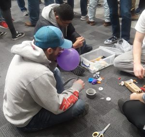  A team prepares for the design Olympics event