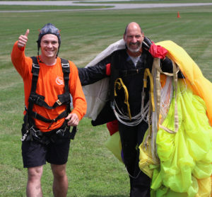 Student and skydive instructor folowing jump