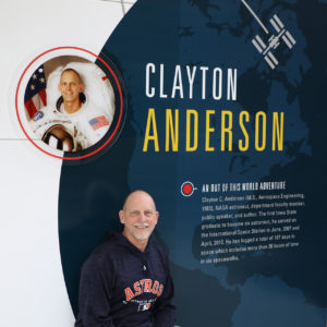 Clayton Anderson next to the "Clayton Wall"
