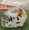 A white football helmet with the I-State athletic logo in red and yellow on the side