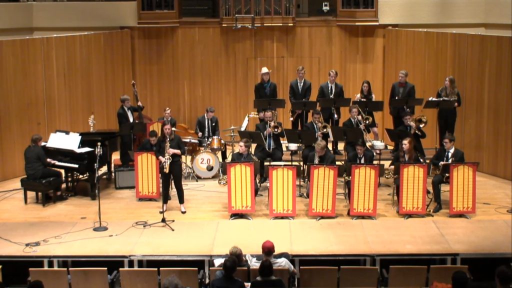 A jazz big band performs a show at the Memorial Union in November 2018. Olivia Tyrrell, a mechanical engineering students, stands and plays a solo on her saxophone.