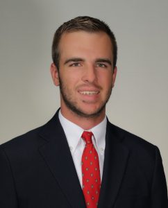 Headshot photo of Jarrett Loseke smiling