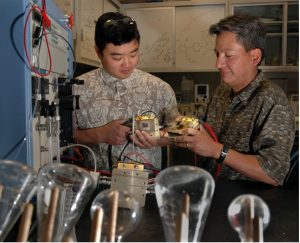 Cornelius working with a postdoc in a lab