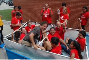 Cornelius with summer high school camp kids in a boat type device