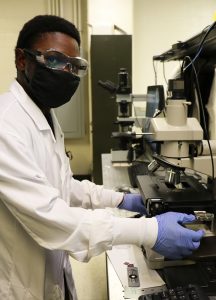 Student Derrick Sanders working in lab