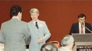 Jerry Chase shaking hands with someone at the Iowa State Center