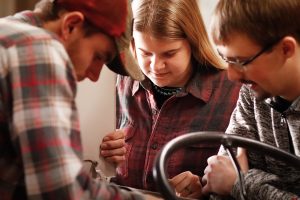 students repairing the tractor