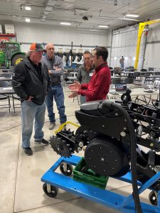 ABE technical project specialist Levi Powell teaching farmers about planter optimization and setup