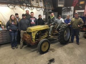 Photo of the tractor before it was repaired, yellow and rusty