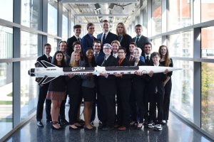 CyLaunch team posing with rocket