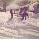 Larry shovels snow outside of their Pammel Court living unit as an uncharacteristic April snow fall.