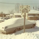 The Pithan's car covered in snow outside of their Pammel Court unit.
