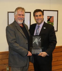 Alric Rothmayer presents Hall of Dinstinguished Alumni plaque to Joel Montalbano