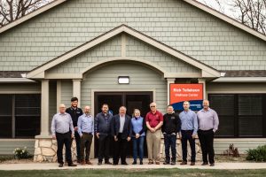 Photo of Tollakson with all of the Hubbell Realty employees that are also ISU CCEE alums