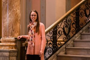 Photo of Ellen standing on the stairs in the World Food Prize Building