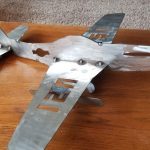A metal rendition of a WWII-era plane