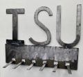 A metal coat rack with the letter ISU