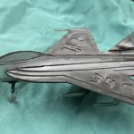 A metal rendition of a fighter jet