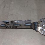 A metal rendition of a flipper/spatula