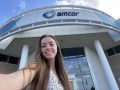 Selfie of student in front of Amcor building