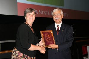 Photo of Sue receiving an award