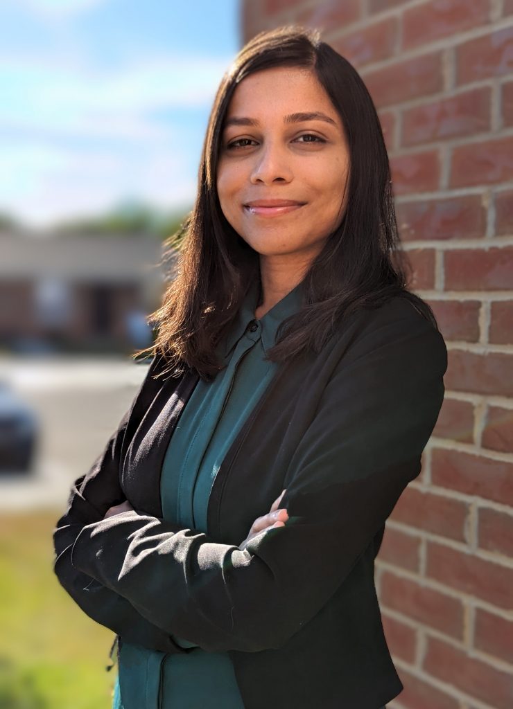 Dr. Aishwarya smiles and poses for the camera 