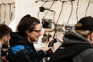 Photo of a student operating a system they built in ABE 410