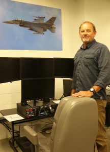 Dwight DeJong with flight simulator