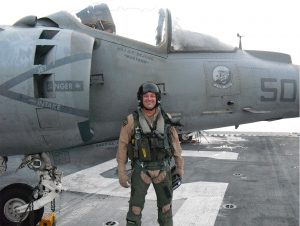 Dwight DeJong with AV-8B Harrier on deck of USS Bataan