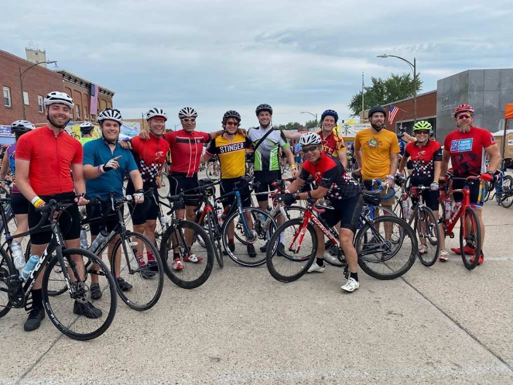 Bicycle riders smile and pose for the camera during RAGBRAI