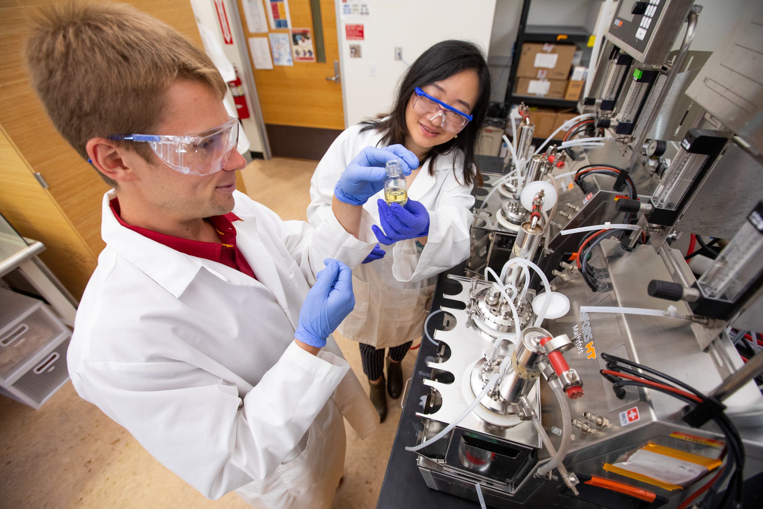 Two researchers work in the lab