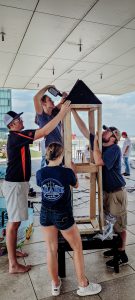 Photo of students building a mini campanile model for the competition