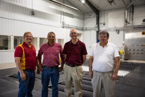 Photo of four team members. From left to right: Andy Suby, Ario Kordestani, Brian Steward, Stuart Birrell