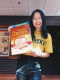 Ani Yam holds a box of Cheerios