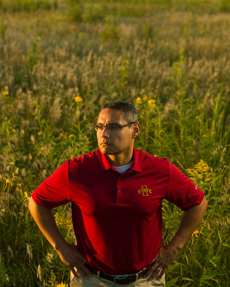 Antonio Arenas standing in prairie strip
