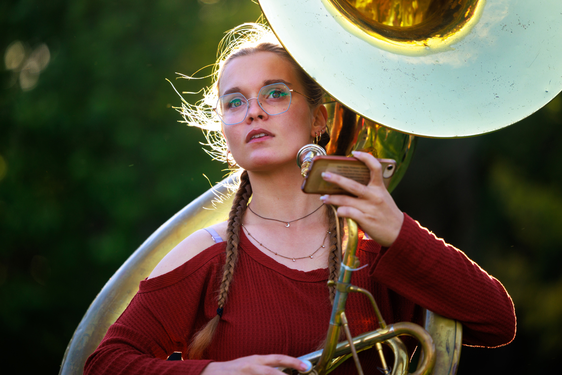 Anna Hackbarth holds a sousaphone