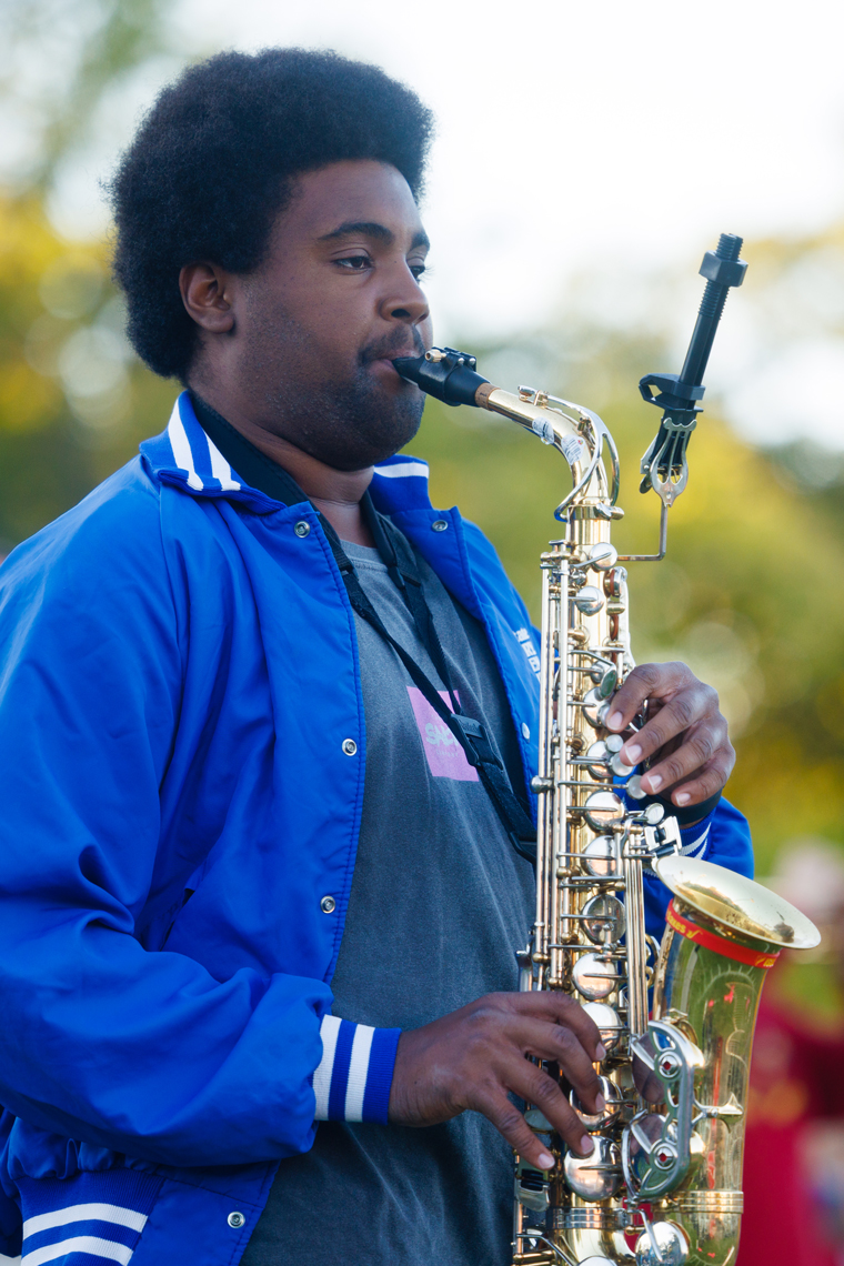 Marching band member plays the sax