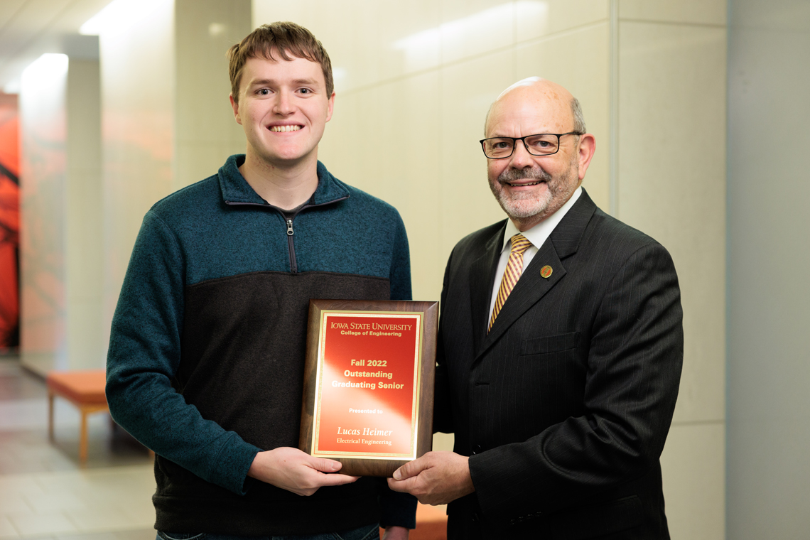 Lucas Heimer, outstanding senior in electrical engineering, with W. Samuel Easterling, James L. and Katherine S. Melsa Dean of Engineering.