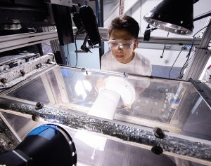 Student observing ice accretion in Department of Aerospace Engineering Icing Research Tunnel.