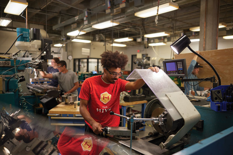 Student working with equipment on a project.