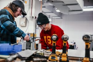 Students in Dolphin's class spot welding the skeletons of their toolbox