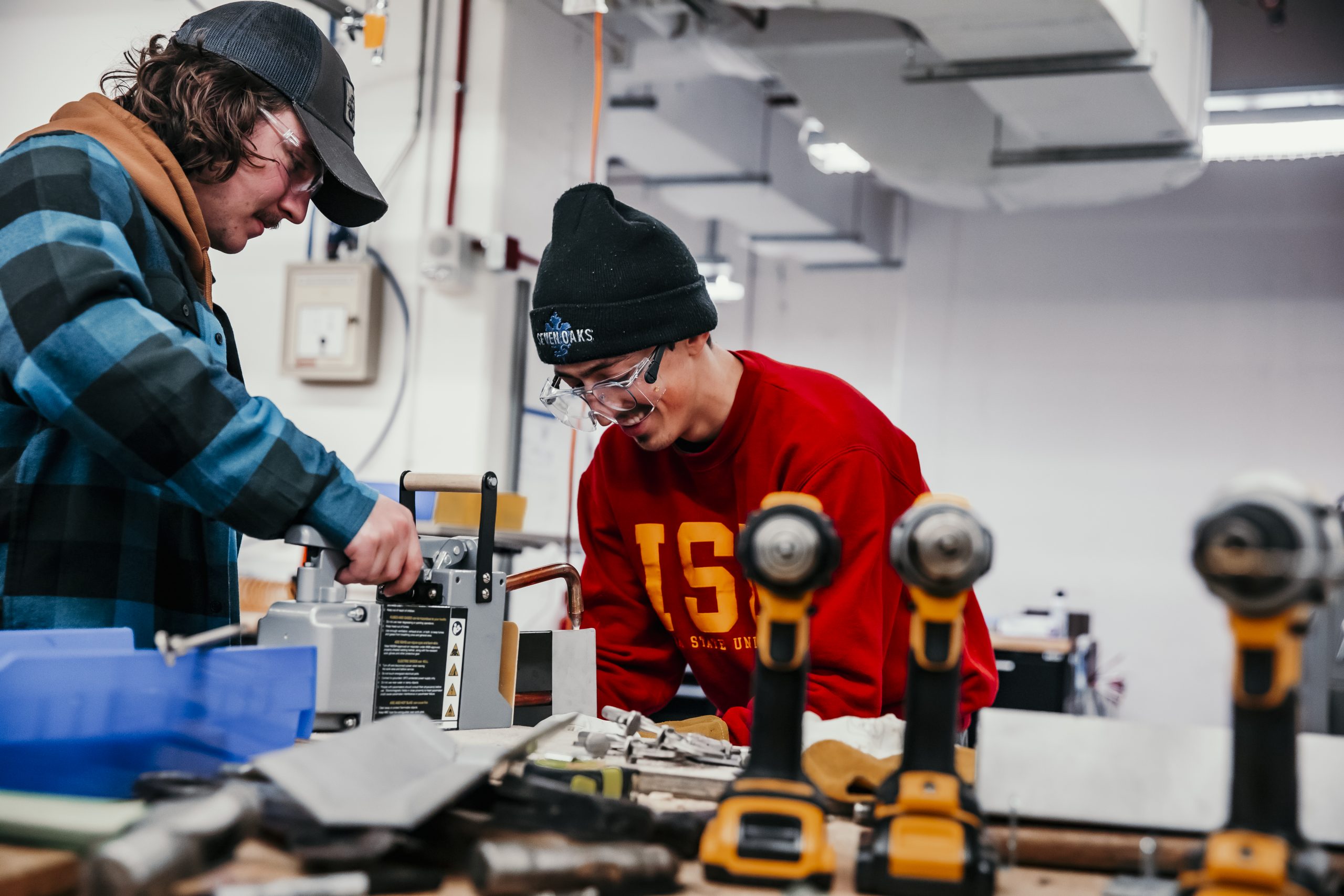 Students in Dolphin's class spot welding the skeletons of their toolbox